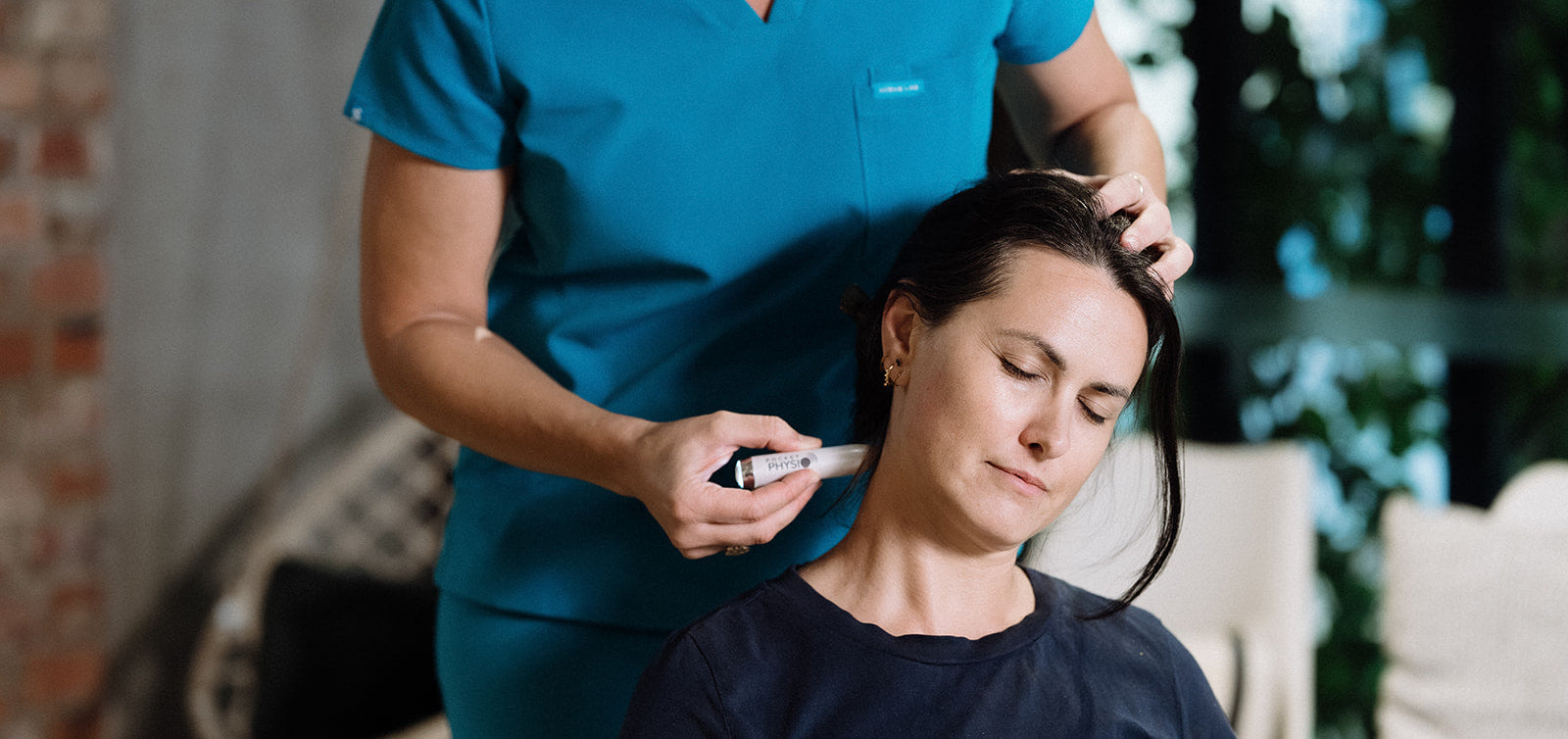 Physio apllying Pocket physio to release neck tension 